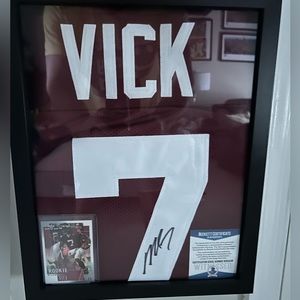 Michael Vick autographed replica Virginia Tech jersey with Rookie Card framed.